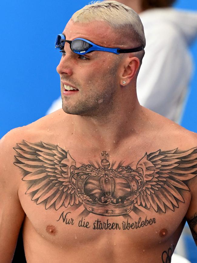 Kyle Chalmers ans his journal. Photo by William WEST / AFP.