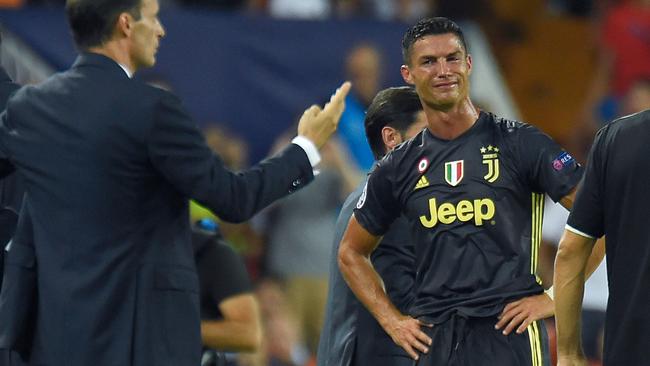 Cristiano Ronaldo reacts after receiving a red card in his first appearance for Juventus in the Champions League