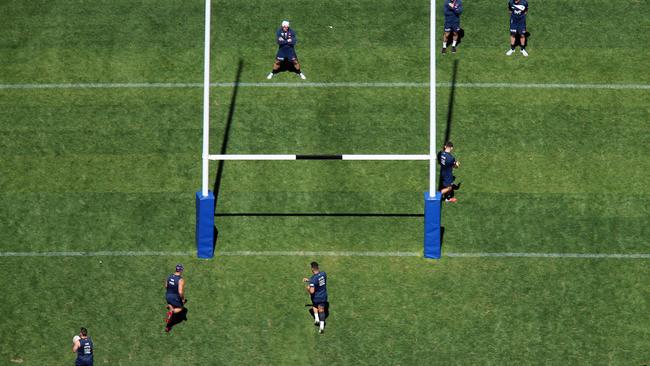 Cronk (white hat and boots) misses Roosters training. (Sam Ruttyn)