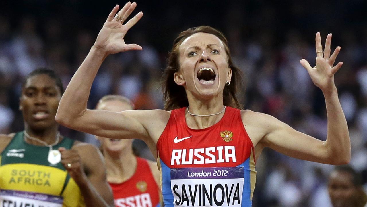 FILE - In this Aug. 11, 2012 file photo Russia's Mariya Savinova celebrates as she crosses the finish line ahead of South Africa's Caster Semenya during the athletics in the Olympic Stadium at the 2012 Summer Olympics, London. (AP Photo/Anja Niedringhaus, file)