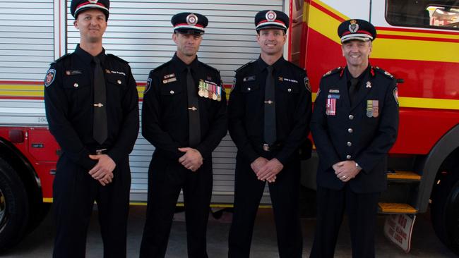 Queensland Fire &amp; Rescue Services’ new recruits (from left) David Triscaru, Benjamin Bourne, Justin Watts and North Coast Region Assistant Commissioner Gary McCormack. Photo: Brett Stephens.