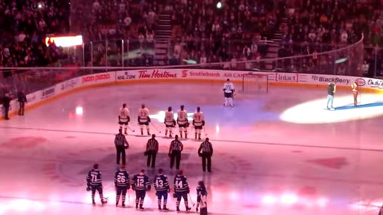 The Barenaked Ladies don Toronto Maple Leaf jerseys and sing the national  anthem on center ice before the game as the Leafs host the Ottawa Senators  on opening night of the new
