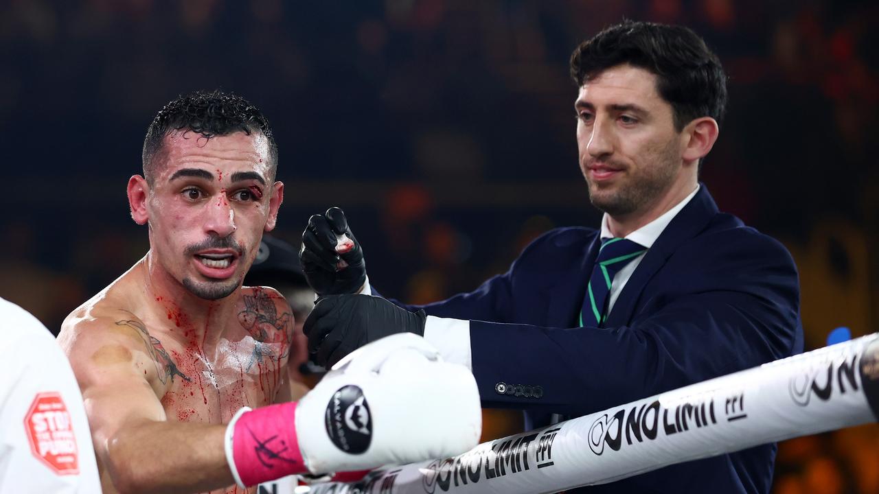 Hassan Hamdan receives medical attention from the doctor during his fight with Justin Frost. Picture: Getty Images