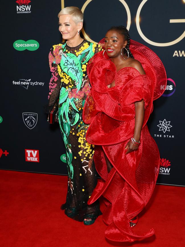 Suzan Mutesi posing for a photo on the media wall with her friend Jessica Rowe. Picture: Matrix.