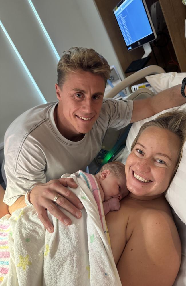 Tasmanian ironman champion Matt Bevilacqua and partner Brielle Cooper with their new baby Beau Peter born on the Gold Coast on May 28. Picture supplied by the family.