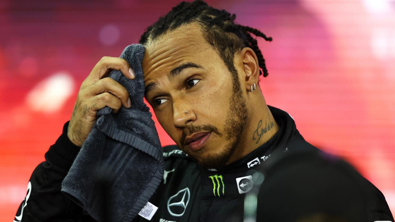 ABU DHABI, UNITED ARAB EMIRATES - DECEMBER 12: Second placed and championship runner up Lewis Hamilton of Great Britain and Mercedes GP looks dejected in parc ferme during the F1 Grand Prix of Abu Dhabi at Yas Marina Circuit on December 12, 2021 in Abu Dhabi, United Arab Emirates. (Photo by Bryn Lennon/Getty Images) *** BESTPIX ***