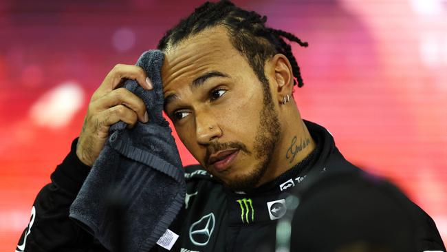 ABU DHABI, UNITED ARAB EMIRATES - DECEMBER 12: Second placed and championship runner up Lewis Hamilton of Great Britain and Mercedes GP looks dejected in parc ferme during the F1 Grand Prix of Abu Dhabi at Yas Marina Circuit on December 12, 2021 in Abu Dhabi, United Arab Emirates. (Photo by Bryn Lennon/Getty Images) *** BESTPIX ***