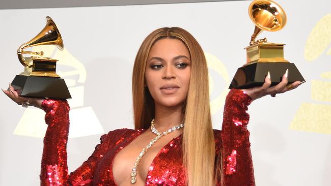 Beyonce poses with her gongs during the 59th Grammy Awards in 2017.