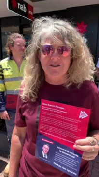 Move Beyond Coal rallies outside the NAB in Mackay on November 11, 2022