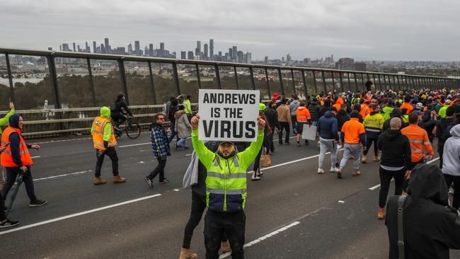 Protesters march on Westgate Bridge in Melbourne after Daniel Andrews’ government announced a construction shutdown on September 21, 2021. Picture: Getty Images