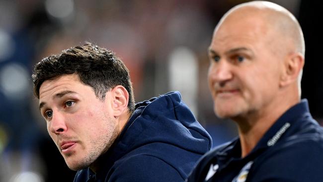 BRISBANE, AUSTRALIA - AUGUST 11: Mitchell Moses of the Eels is seen alongside Coach Brad Arthur and looking dejected after sustaining an injury during the round 24 NRL match between the Brisbane Broncos and Parramatta Eels at The Gabba on August 11, 2023 in Brisbane, Australia. (Photo by Bradley Kanaris/Getty Images)