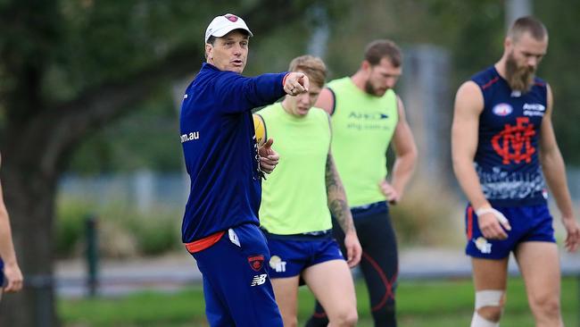 Melbourne coach Paul Roos directs his players at training. Picture: Wayne Ludbey