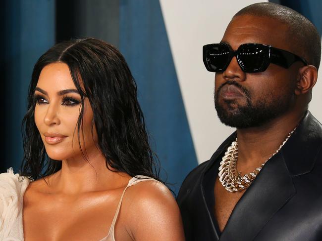 (FILES) In this file photo US media personality Kim Kardashian (L) and husband US rapper Kanye West attend the 2020 Vanity Fair Oscar Party following the 92nd Oscars at The Wallis Annenberg Center for the Performing Arts in Beverly Hills on February 9, 2020. - Rapper Kanye West and his reality TV star wife Kim Kardashian West are living separately and undergoing marriage counseling, NBC News reported, citing a source close to the family. For the past few months West, 43, has been living in Wyoming while Kardashian West, 40, and their four children stayed in California, the source said on January 5, 2021. (Photo by Jean-Baptiste Lacroix / AFP)