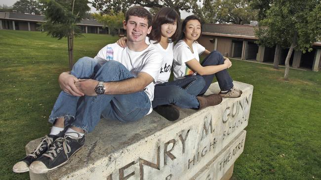 Show of support: Yoni Alon, Esther Han and Joyce Liu, students at Henry M. Gunn High School pose for a photo in 2009. The three created a student-run support group ROCK, also known as ‘Reach Out. Care. Know.’ Picture: Tony Avelar/AP