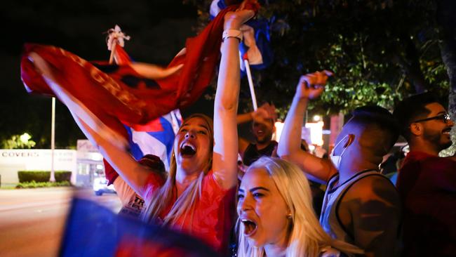 Young Trump supporters revel and rally in front of a Cuban restaurant in Miami, Florida. Picture: AFP