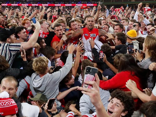 Lance Franklin buried among the swarm of fans. Picture: Getty Images