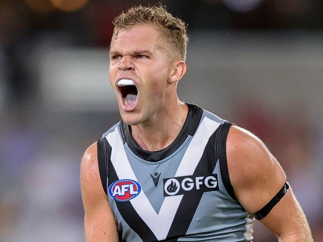 BRISBANE, AUSTRALIA - MARCH 19: Dan Houston of the Power celebrates a goal during the 2022 AFL Round 01 match between the Brisbane Lions and the Port Adelaide Power at The Gabba on March 19, 2022 In Brisbane, Australia. (Photo by Russell Freeman/AFL Photos)