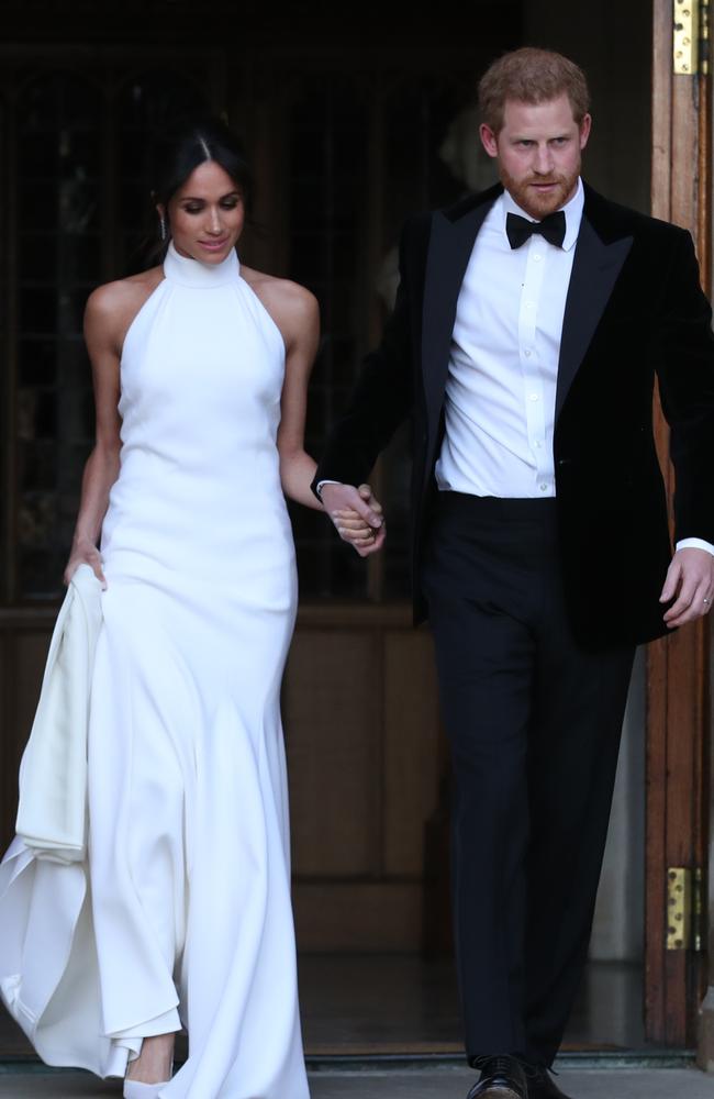 The newly married Duke and Duchess of Sussex, Meghan Markle and Prince Harry, leaving Windsor Castle after their wedding to attend an evening reception at Frogmore House, hosted by the Prince of Wales. Picture: Mega