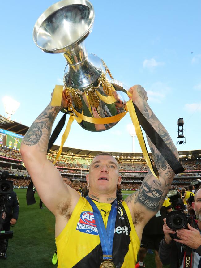 Dustin Martin celebrates with the AFL Premiership Cup. Picture: Scott Barbour