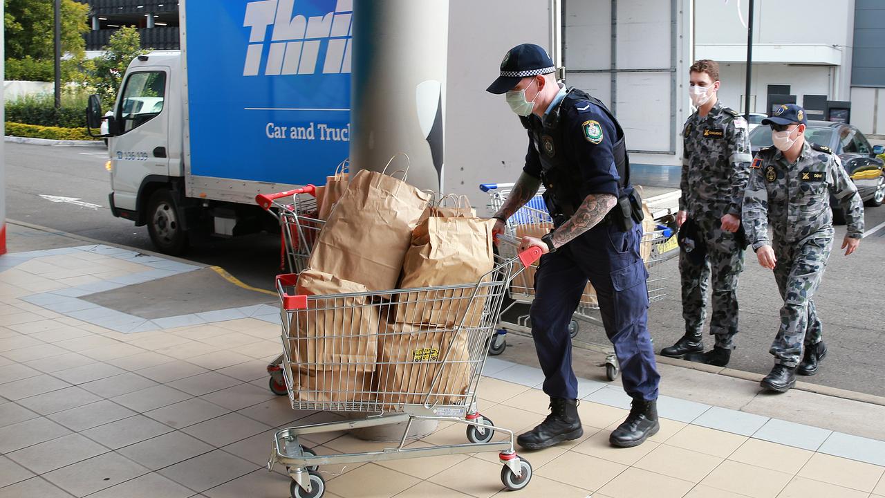 The officers helped deliver food to locked-in residents. Picture: NCA NewsWire / Dylan Coker