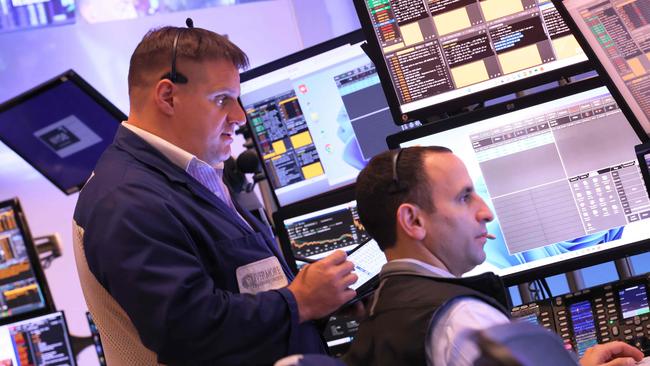 Traders work on the floor of the New York Stock Exchange on Thursday. Picture: Getty Images