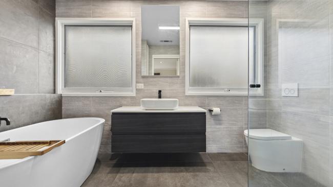 The home’s three bathrooms are light and bright.