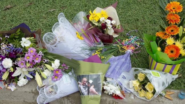 Tributes for Shandee Blackburn at the murder scene in Mackay.