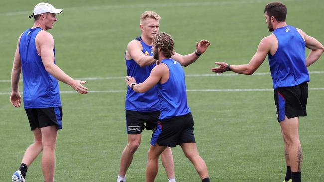 Bulldogs players get around their new teammate. Picture: Ian Currie