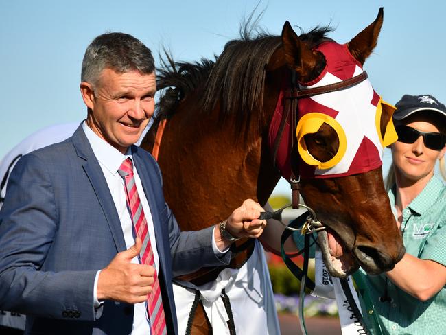 Trainer Matthew Smith poses with Fierce Impact after winning in race 9, the Lamaro's Hotel Sth Melbourne Toorak Handicap, during the Caulfield Guineas Day at Caulfield Racecourse in Melbourne, Saturday, October 12, 2019. (AAP Image/Vince Caligiuri) NO ARCHIVING, EDITORIAL USE ONLY