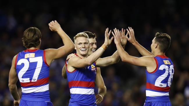 Adam Treloar (middle) and Anthony Scott (right) have been added to the mix. Picture: Darrian Traynor/AFL Photos/Getty Images