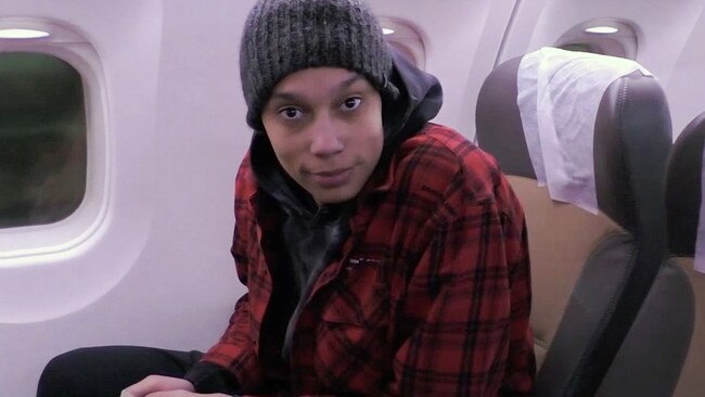 Griner is seen on a plane ahead of departing for the United States.