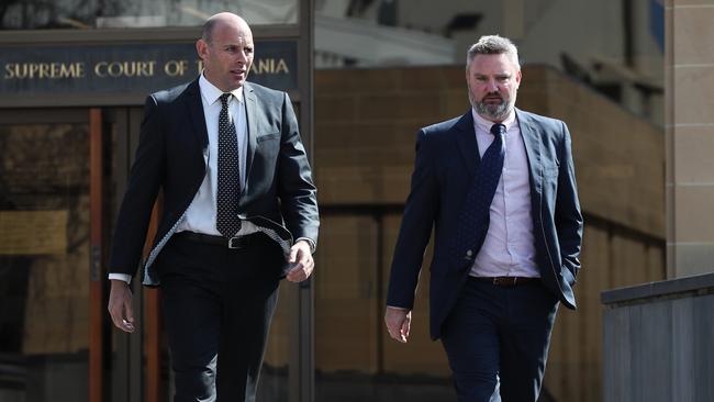 Detective Senior Constable Nathan Robinson and Detective Sergeant Kim Norton leave the Supreme Court. Picture: LUKE BOWDEN