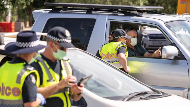 Police checkpoints are set up at the major road entry points into Victoria. Picture: Simon Dallinger.