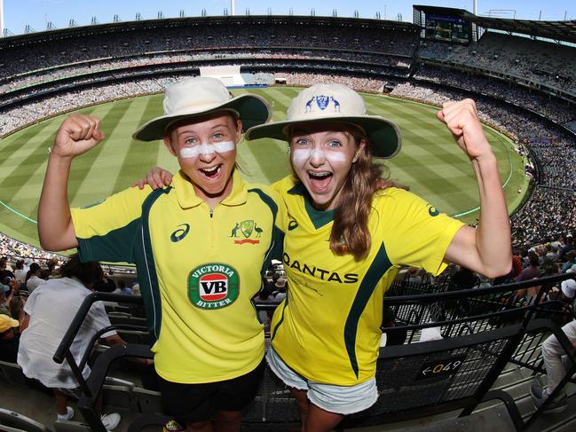 2022 Boxing Day Test MCG. Australia vs South Africa. Crowd colour. Aussie fans Emma Gouws 15 and friend Hilary Roach 15 both play cricket and came dressed with floppy cricket has and zinc cream in honour of Shane Warne.                      Picture: David Caird