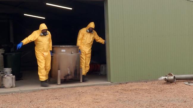 Police officers who were part of Strike Force Bluffview dismantling the drug lab at Harolds Cross, near Braidwood, last year. Picture: NSW Police