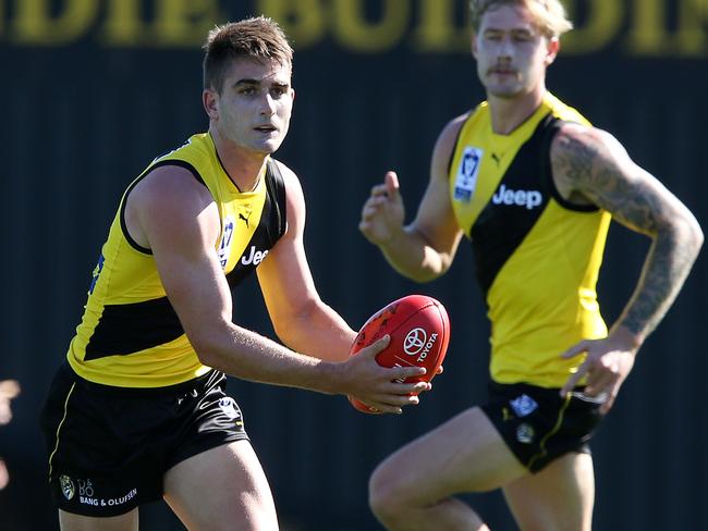 Anthony Miles, left, in action for Richmond in the VFL — a competition he is far too good for.