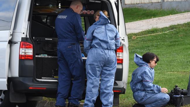 Forensic police investigate at the scene of the shooting. Picture: Kylie Else