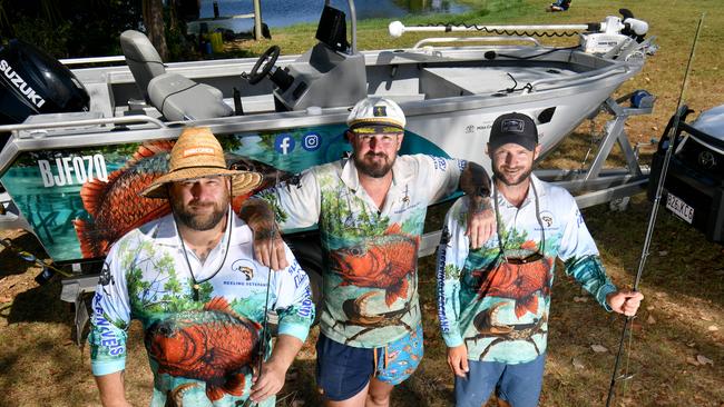 Reeling Veterans Queensland president Michael King with secretary Steve Lillie and vice president Scot Ruehland with a boat donated by a veteran at the Townsville Barra Fun Park. Picture: Evan Morgan