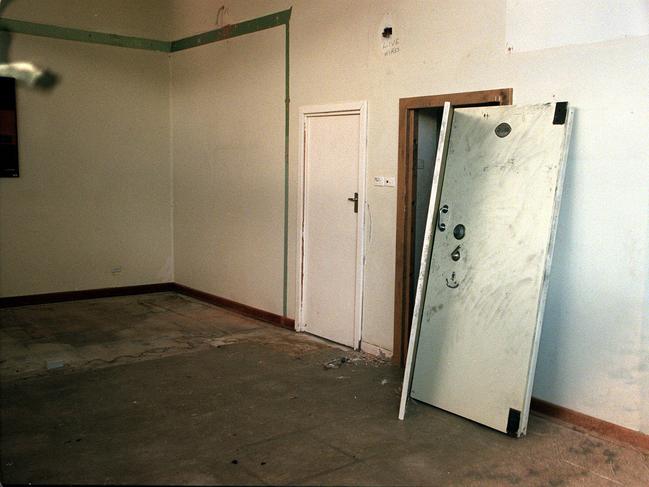 The door to the disused bank vault off its hinges in the abandoned State Bank in Snowtown. Picture: Leon Mead