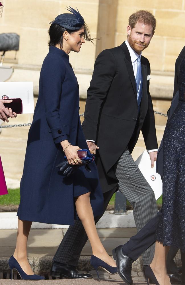 Meghan hid her baby bump under an oversized coat. Picture: Will Oliver/EPA