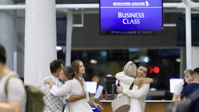 Brittany Higgins and her fiance David Sharaz depart Brisbane international Airport bound for France. They were farewelled by her parents at the business class gate. Picture: Backgrid/news.com.au