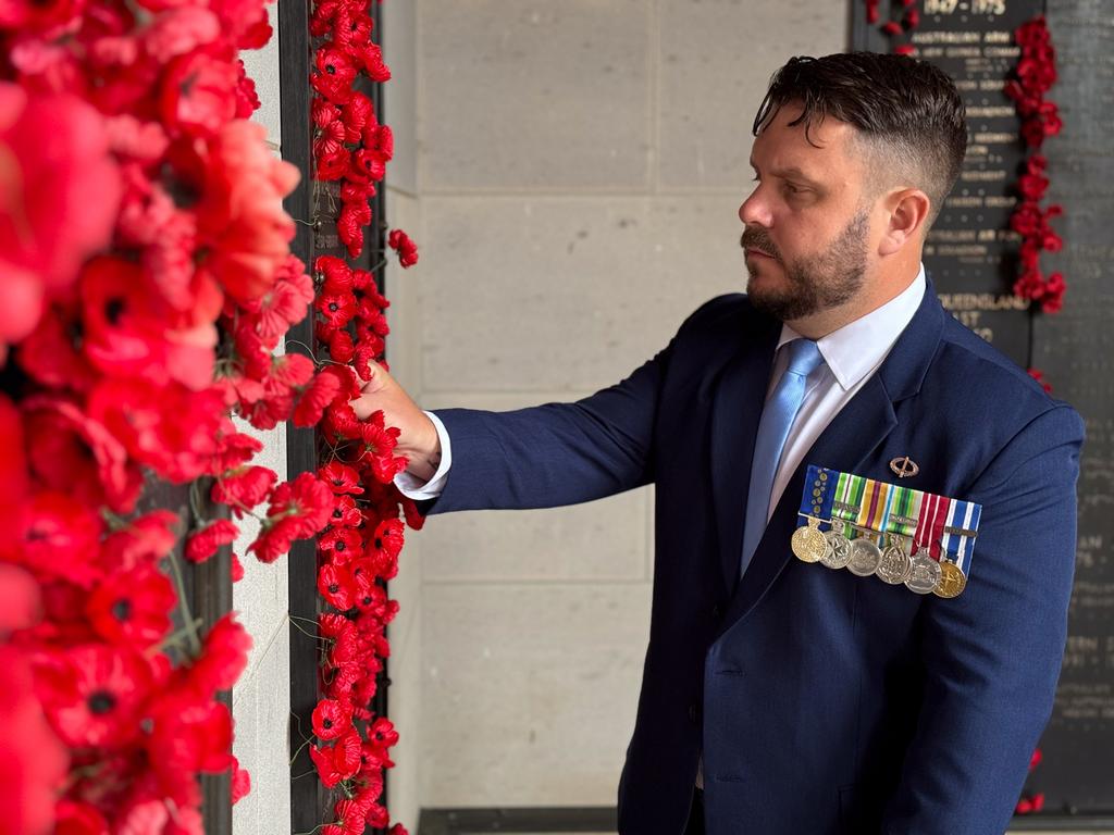 Member for Herbert, Phillip Thompson visiting a war memorial.