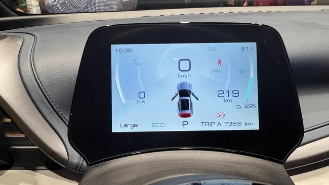 The smaller display behind the steering wheel shows driving metrics