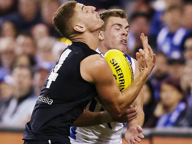 MELBOURNE, AUSTRALIA - MAY 05: Cameron Zurhaar of the Kangaroos collides into Liam Jones of the Blues (L) during the round seven AFL match between the Carlton Blues and the North Melbourne Kangaroos at Marvel Stadium on May 05, 2019 in Melbourne, Australia. (Photo by Michael Dodge/Getty Images)