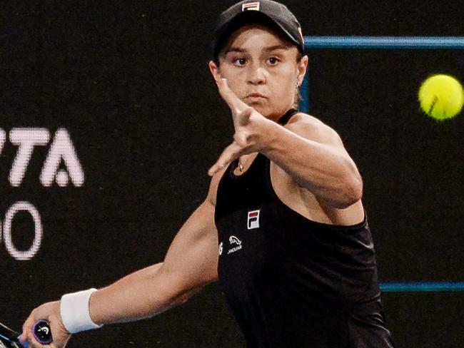 Ashleigh Barty of Australia hits a return to USA's Coco Gauff during their women's singles match at the Adelaide International tennis tournament in Adelaide on January 5, 2022. (Photo by Brenton Edwards / AFP) / -- IMAGE RESTRICTED TO EDITORIAL USE - STRICTLY NO COMMERCIAL USE --