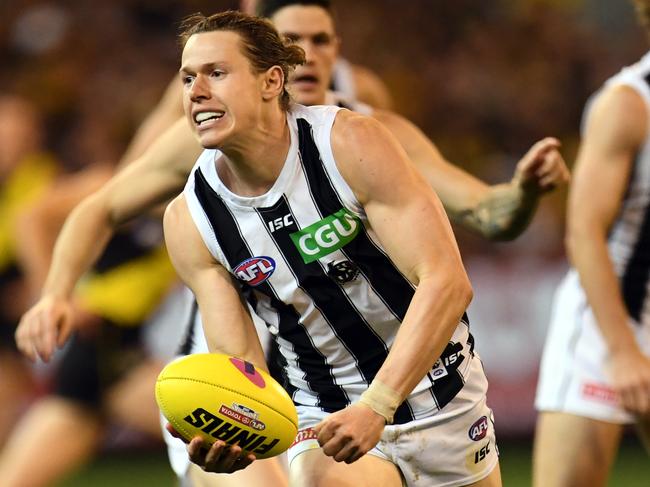 Tom Langdon of the Magpies is seen in action during the First Preliminary Final between the Richmond Tigers and the Collingwood Magpies in Week 3 of the AFL Finals Series at the MCG in Melbourne, Friday, September 21, 2018. (AAP Image/Julian Smith) NO ARCHIVING, EDITORIAL USE ONLY