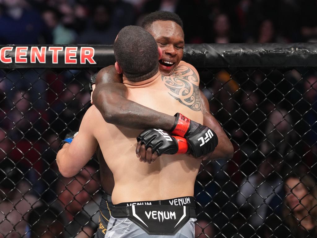 The pair embrace after their brilliant second title fight. Picture: Josh Hedges/Zuffa LLC