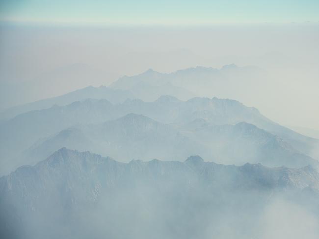 2019 Tasmanian bush fires. Layers of the Western Arthur Range in smoke, Riveaux Road Fire - at Southwest National Park. . Picture - LUKE TSCHARKE / PAR AVION