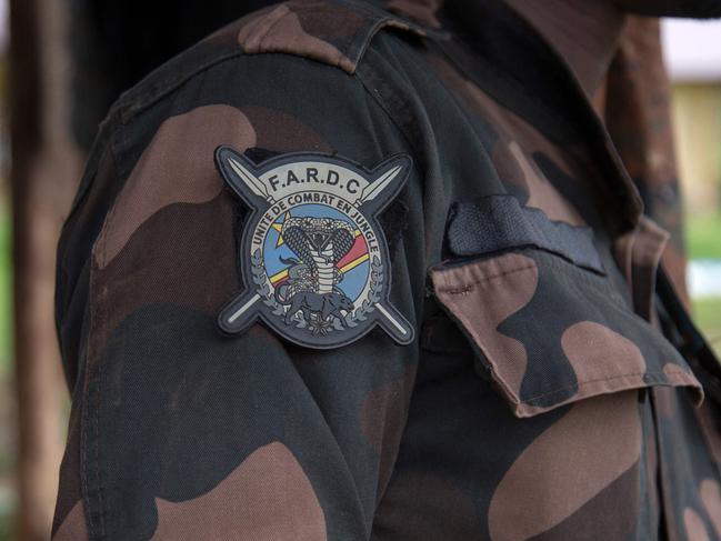 A general view of a badge of the Armed Forces of the Democratic Republic of the Congo (FARDC) on a soldier's sleeve in Lubero on December 26, 2024. (Photo by Seros MUYISA / AFP)