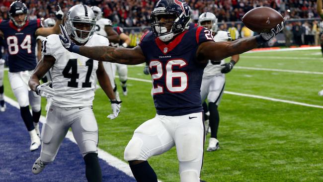 Lamar Miller #26 of the Houston Texans rushes for a touchdown.